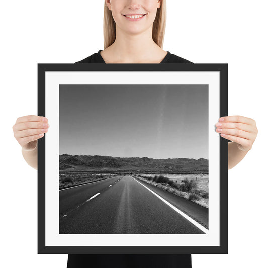 Framed photo paper poster with grayscale road view, black frame and wide border